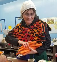 Odile cooking at Hidden Mountain's Baronial Birthday, 2019